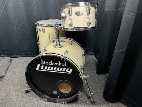 Image of Ludwig Classic Maple 100th Anniversary drumset in White Marine Pearl, featuring a 20-inch bass drum, 12-inch tom, and 16-inch floor tom.